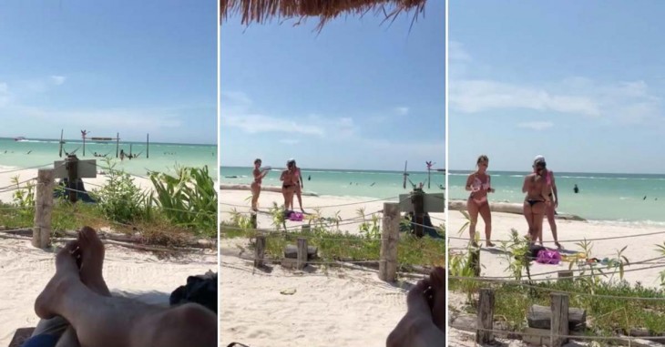 Homem faz zoom com o celular na praia
