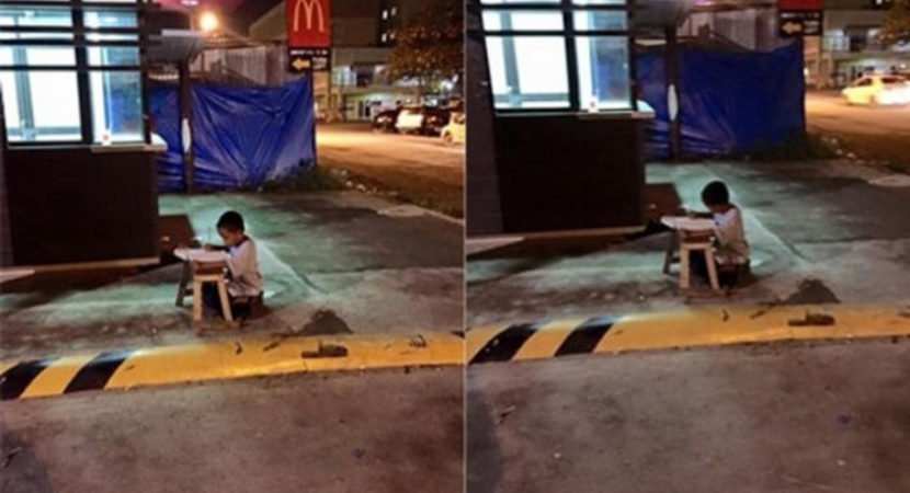 Menino morador de rua usa luz do McDonald’s